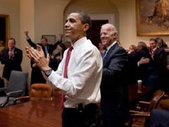 President Obama and VP Joe Biden applaud the House passage of the health reform bill.